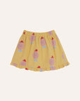 The campamento - kids - happy man yellow skirt